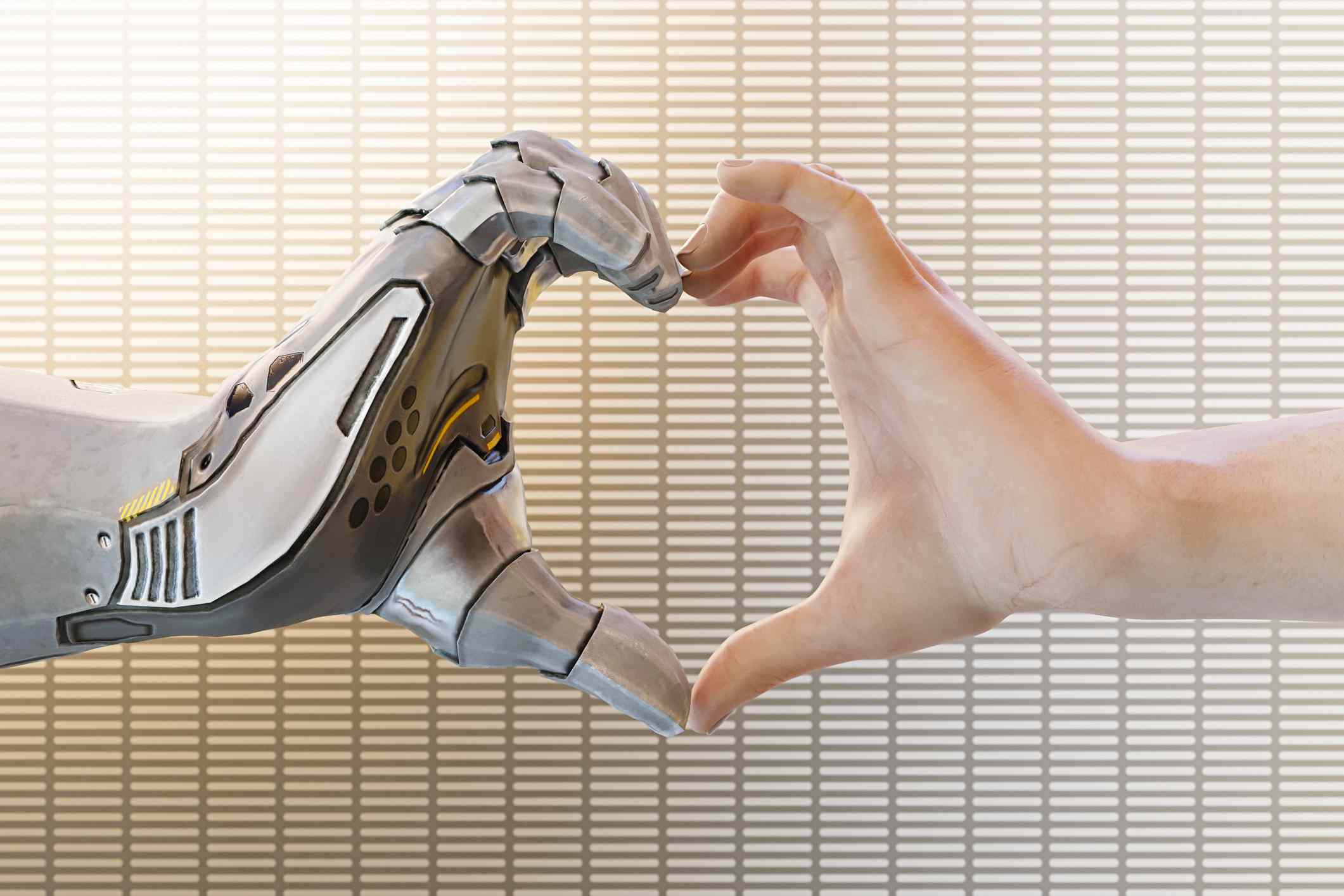 Робот і людська рука, що утворюють форму серця. 